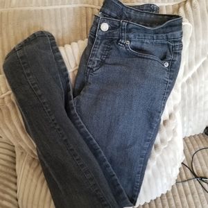 Womens mid-rise faded gray jeans.